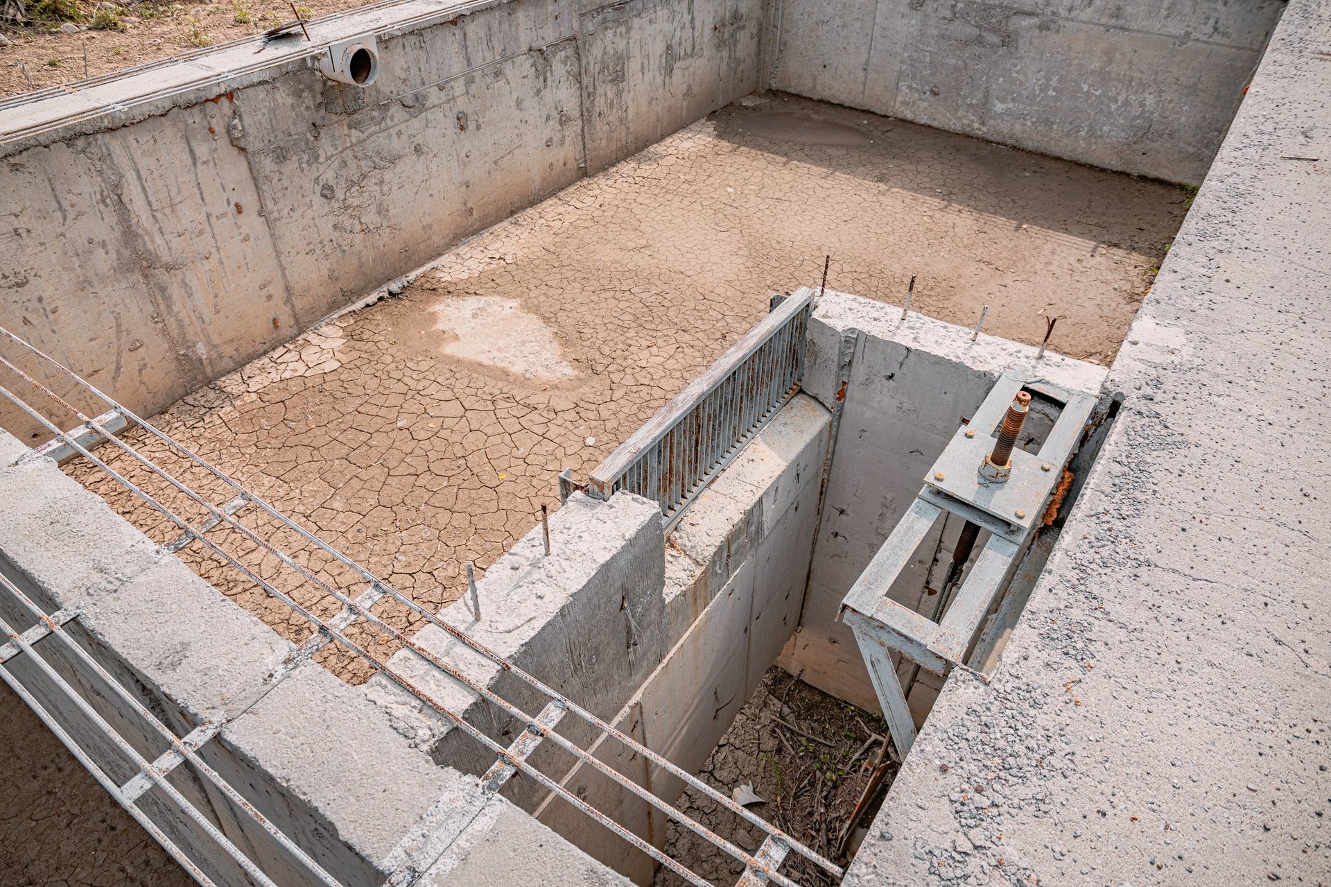 Reinforcement bars staged at a water-side concrete structure during construction