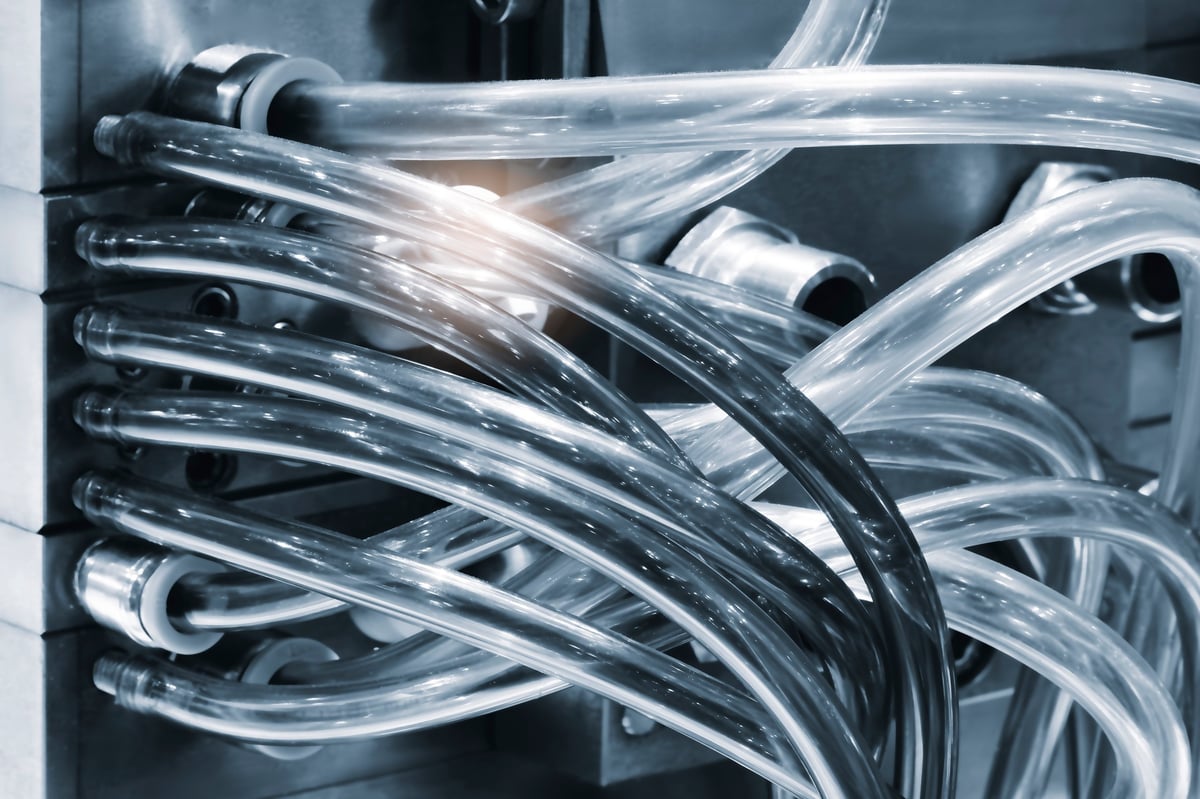 Close-up of pressure tubing and valves on industrial process equipment